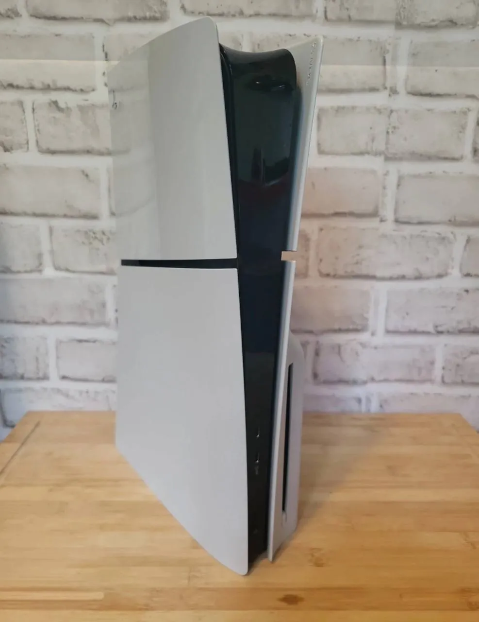playstation 5 slim disc edition in perfect condition with a controller , ps stand , a game and cabl…